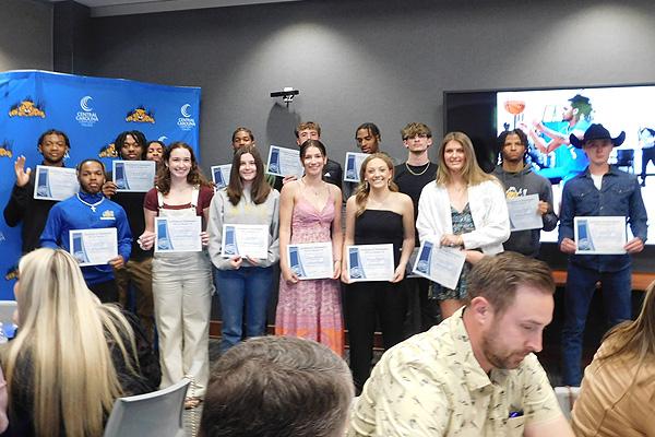 Student athletes posing at banquet
