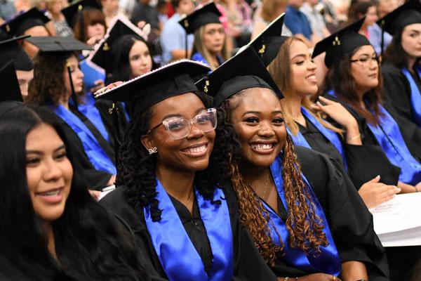 Two happy grads at Graduation, May 2025